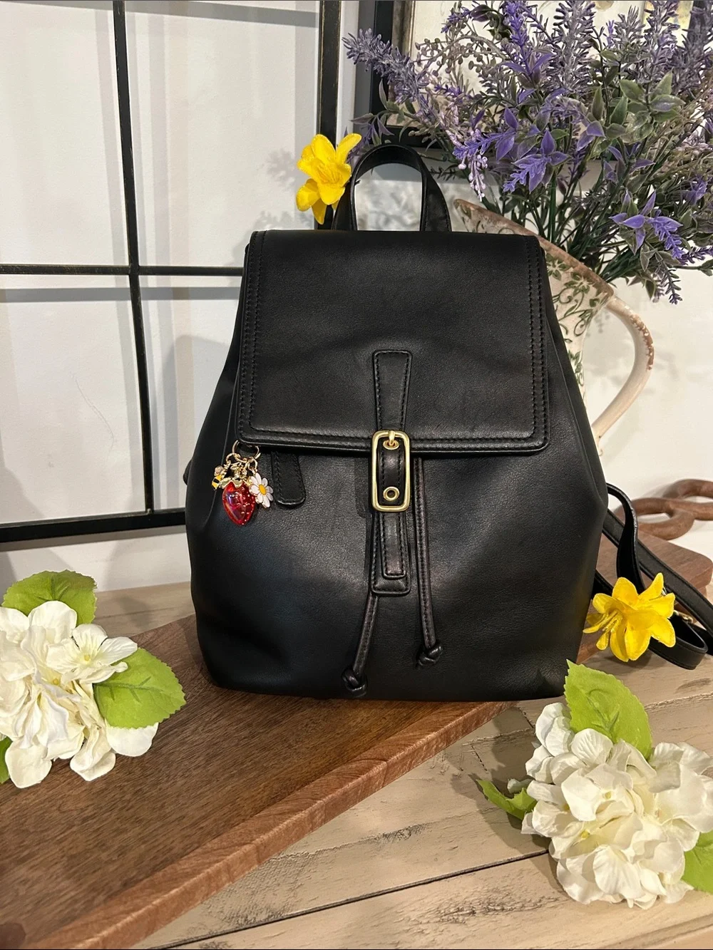 Coach Black Leather Backpack with Gold Buckle and Red Charm